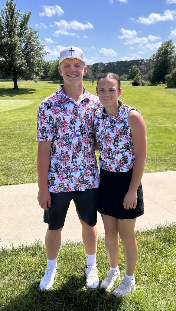 2 golfers posing that attended