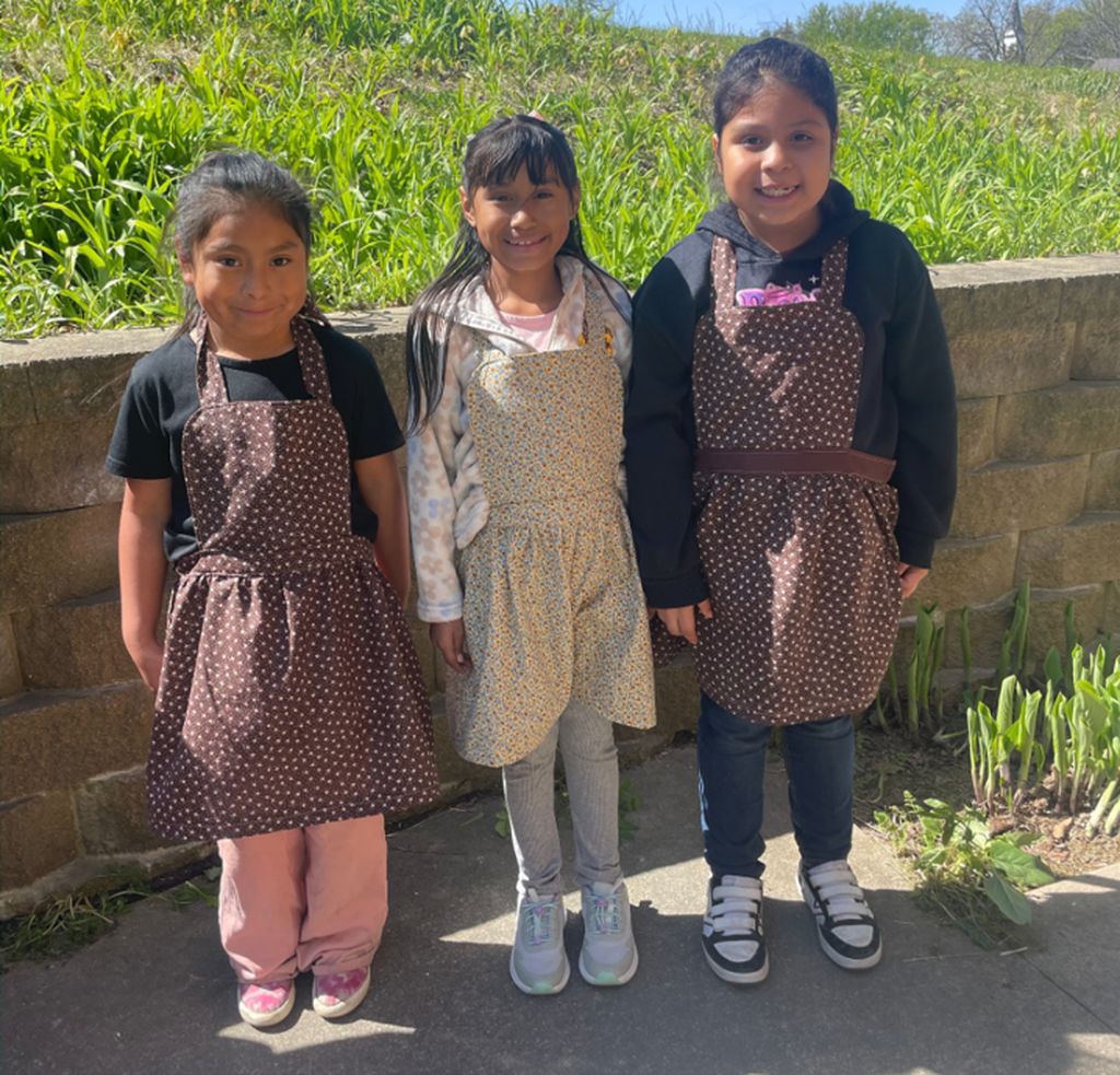 students wearing the aprons
