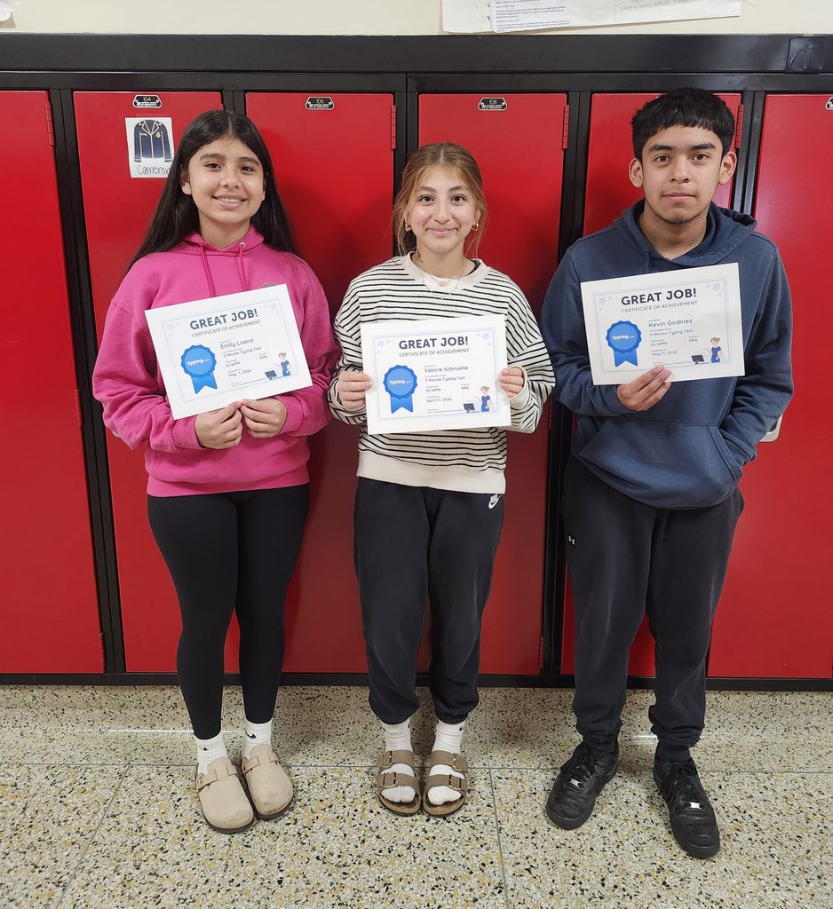students holding certificates of awards